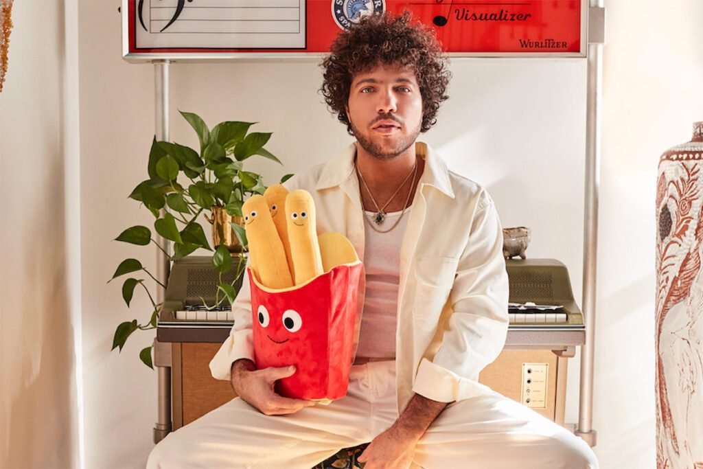 Benny Blanco Holding food. 