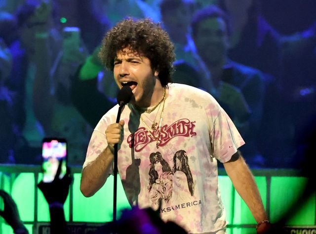 Benny Blanco performing live or DJing at a festival — a shot that captures the energy behind the man who shaped pop’s modern heartbeat.[